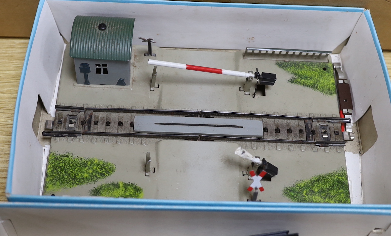 A German Marklin 7390 miniature rail station, tracking, engine and carriages, with original booklet